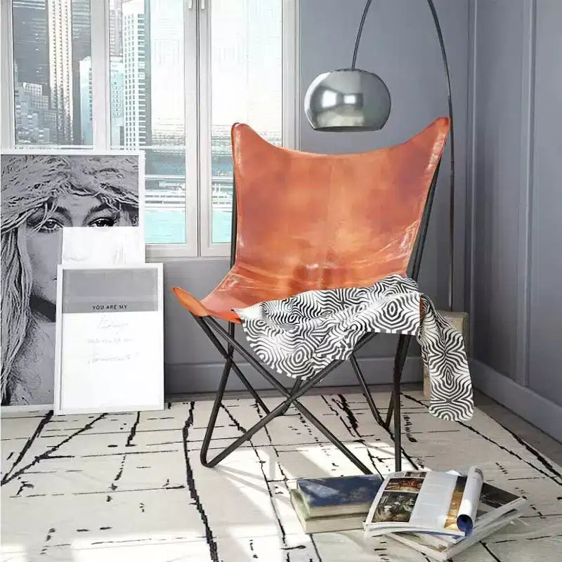 Fauteuil Butterfly en cuir véritable marron, structure en fer thermolaqué